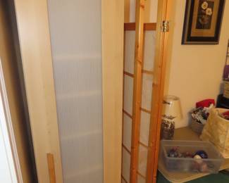 Storage cupboard and three panel screen.