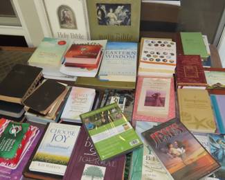 Large antique bibles, daily devotional books, modern bibles, many prayer journals and religious books.
