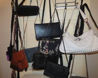 Handbags and purses including Coach, Bagalinni and Steve Madden.