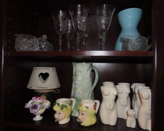 Shelves of porcelain, lead crystal, vintage stemware,