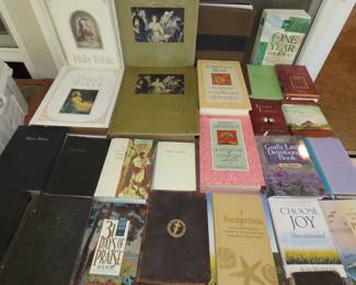 Large antique bibles, daily devotional books, modern bibles, many prayer journals and religious books.