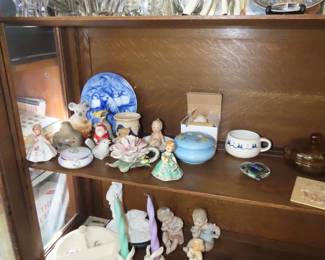 Shelves of porcelain, lead crystal, vintage stemware,