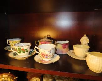 Shelves of porcelain, lead crystal, vintage stemware,