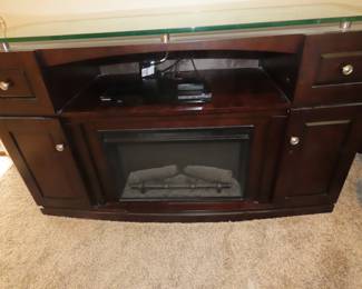 Electric fireplace with media storage/tv stand.