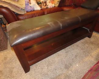 Leatherette bench with shoe shelf underneath.