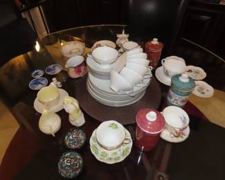 Tea cups, thimbles, cruets, bone china.