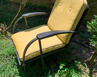 black metal chairs with yellow cushions