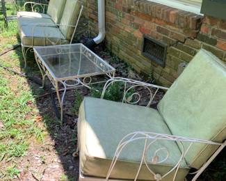 white iron furniture with yellow cushions