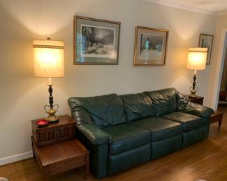 larger of two Mid-Century green "leather" sofas, lamps, end tables, Kasimirs