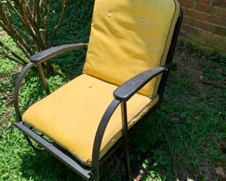 black metal chairs with yellow cushions