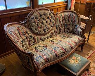 re-upholstered Victorian settee; antique needlepoint footstool