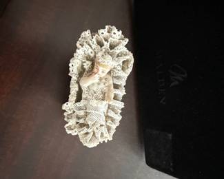 small trinket box in shape of baby in a bassinet