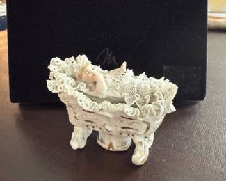 small trinket box in shape of baby in a bassinet