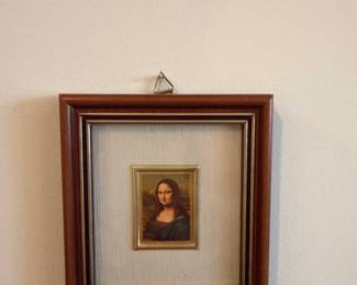 framed miniature reproduction of the Mona Lisa