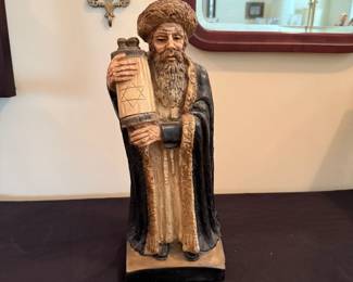 chalkware statue of Hasidic Rabbi holding a Torah