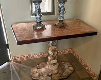 One of a pair of stone top tables