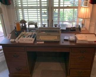 Office desk, Typewriter, and other office supplies  