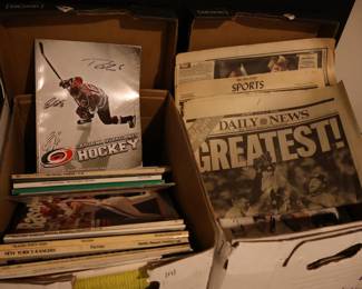 Newspapers, sports yearbooks, signed Hurricanes yearbook!