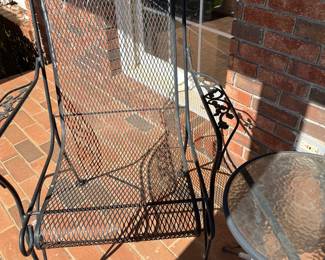 Four black outdoor chairs