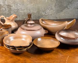 This lot features a collection of eleven (11) pieces of various pottery manufactured by, Frankoma. Frankoma Pottery, founded in 1933 by John Frank in Norman, Oklahoma, is known for its distinctive, handcrafted pottery using Oklahoma clay. Initially named Frank Potteries, it was later incorporated as Frankoma Pottery and relocated to Sapulpa, Oklahoma, in 1938. The company is renowned for its unique glazes, southwestern motifs, and affordable, functional dinnerware. 