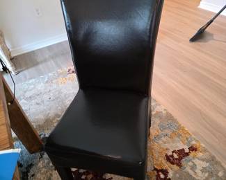 Brown leather Parsons chairs 