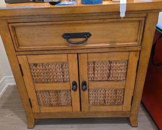 Pair of wood and woven bamboo night stands $300.