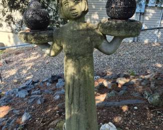 Concrete Statue of Chinese Lady holding small lanterns.