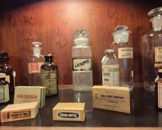 A collection of old medicine bottles and boxes