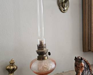 slender antique oil lamp