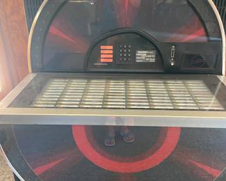 Juke box with original key, turns on and lights up, the original records are there, doesn’t play. Needs work