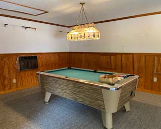 Bar size pool table with pool sticks and balls, overhead light sold separately