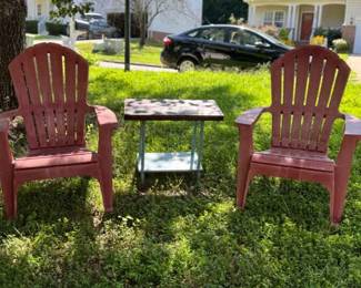 Two Stackable Plastic Adorondack Chairs And Wooden Side Table