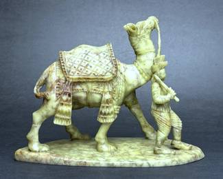 Chinese carved soapstone of man leading a camel