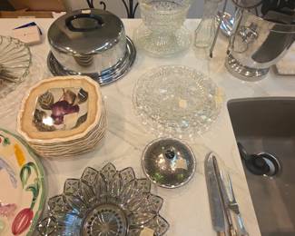 Plates, glass items, vintage cake cover, serving pieces in kitchen