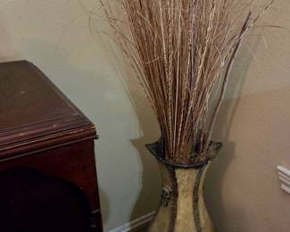 Tall vase with stick stalks