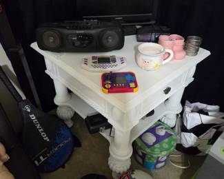White end table, sony cassette stereo, small Television 
