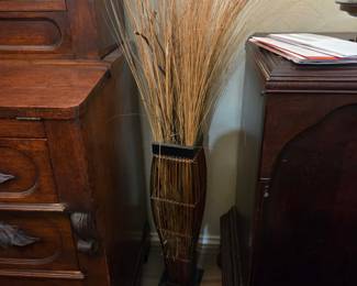 Tall vase with grass stems
