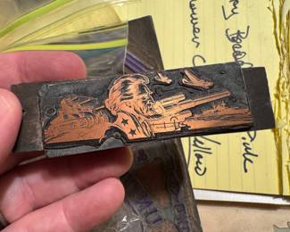 Military printing plate with likeness of tanks and Abe Lincoln