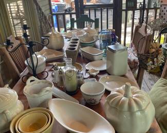 Extensive collection of pottery pieces and lake decor. 
