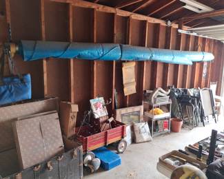 The Blue Tarp on the Wall is a Solar Pool Cover for a Large Oval Swimming Pool!