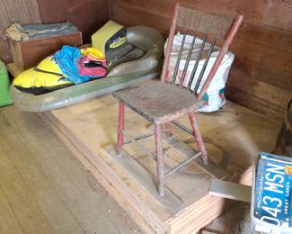 4ft. X 8ft. Chip Board and Pool Floaties and a Old Wooden Chair! License Plates too!