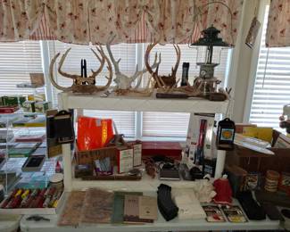 Many Deer Antlers, Coleman Chrome and Green Enamel Lantern, Black Powder Horn and Cans, Gas Pump Nozzle, Gun Magazine Clips and Brand New Emergency Flashlights!