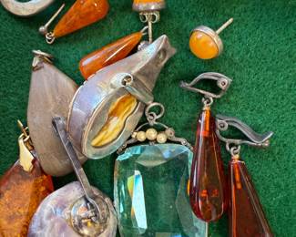 Lots of amber and odd pieces of jewelry here