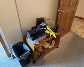 Everyday objects, trash cans, carts, side tables, office pieces, artwork.
