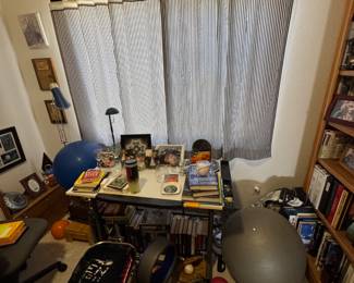 Desk, office full of art, books, text books and more.