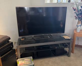 Television Stand and large TV. More specifics coming soon.