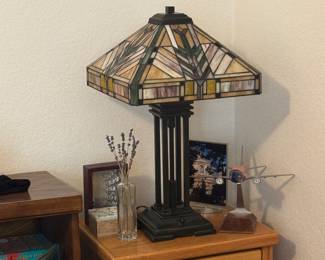 Many great quality oak furniture pieces including side tables, books shelves. PIctured here a "Tiffany style" stained glass lamp.