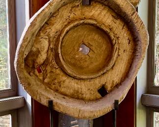 Weathered Wooden Wheel Sculpture on Metal Stand