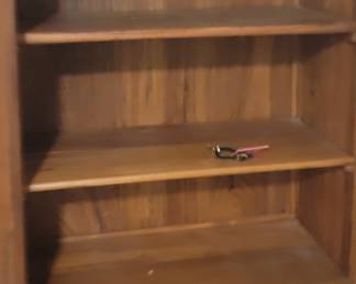 Decorative cabinet with three shelves inside and two drawers, comes with key, top is 35”, 20” deep, 65 ½” tall, base is 42” wide