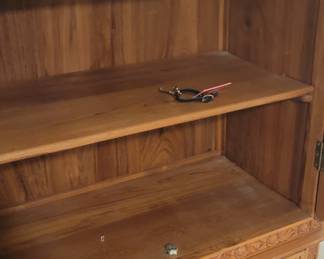 Decorative cabinet with three shelves inside and two drawers, comes with key, top is 35”, 20” deep, 65 ½” tall, base is 42” wide